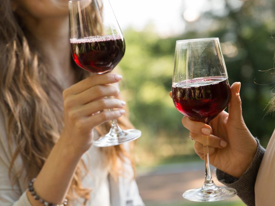 Two women with glasses of red wine