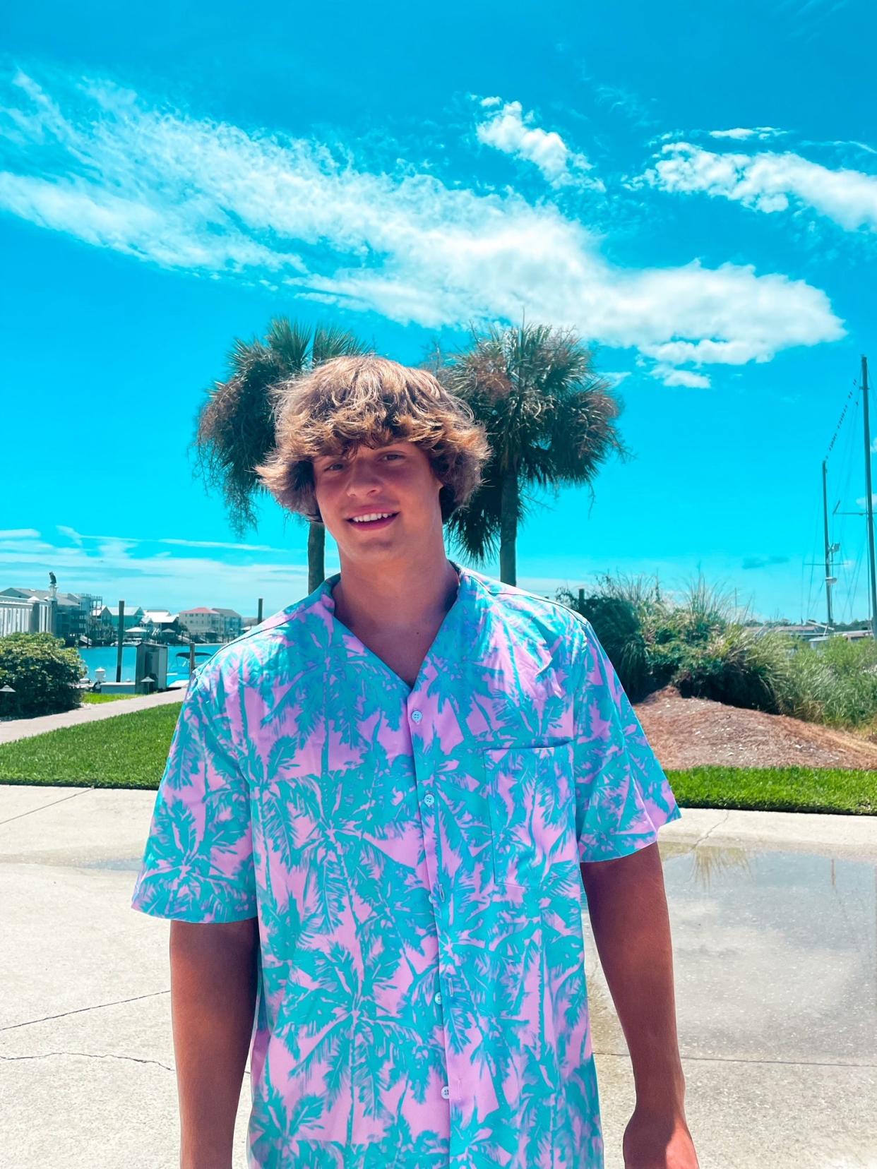 Holden Bierman, founder of Coastal Cool, models one of the button-up, island-inspired shirts from the company's collection. Holden started the business when he was just 14 years old.