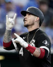 Chicago White Sox's Yasmani Grandal celebrates as he crosses the plate after hitting a two-run home run during the fourth inning of a baseball game against the Kansas City Royals Monday, May 16, 2022, in Kansas City, Mo. (AP Photo/Charlie Riedel)
