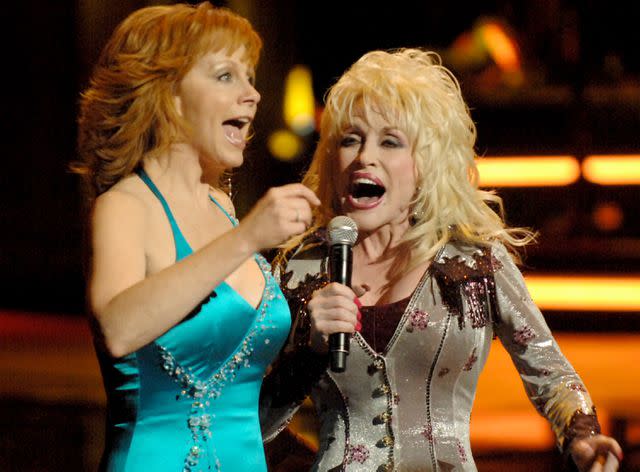 <p>Jeff Kravitz / Contributor/Getty</p> Reba McEntire and Dolly Parton