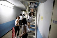 Dancers leave the backstage area before a Stardom female professional wrestling show at Korakuen Hall in Tokyo, Japan, December 23, 2015. REUTERS/Thomas Peter