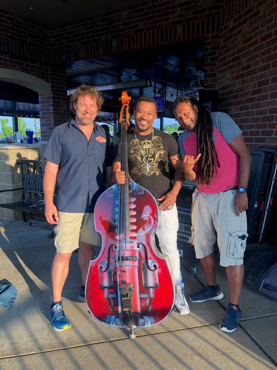 Unity the Band bassist Tim Perkins, from left, Lil Jamaica owner Derron Wilson, and Unity founder and frontman Pita Kotobalavu. Wilson met Kotobalavu six or seven years ago but said he felt like he knew him his whole life.