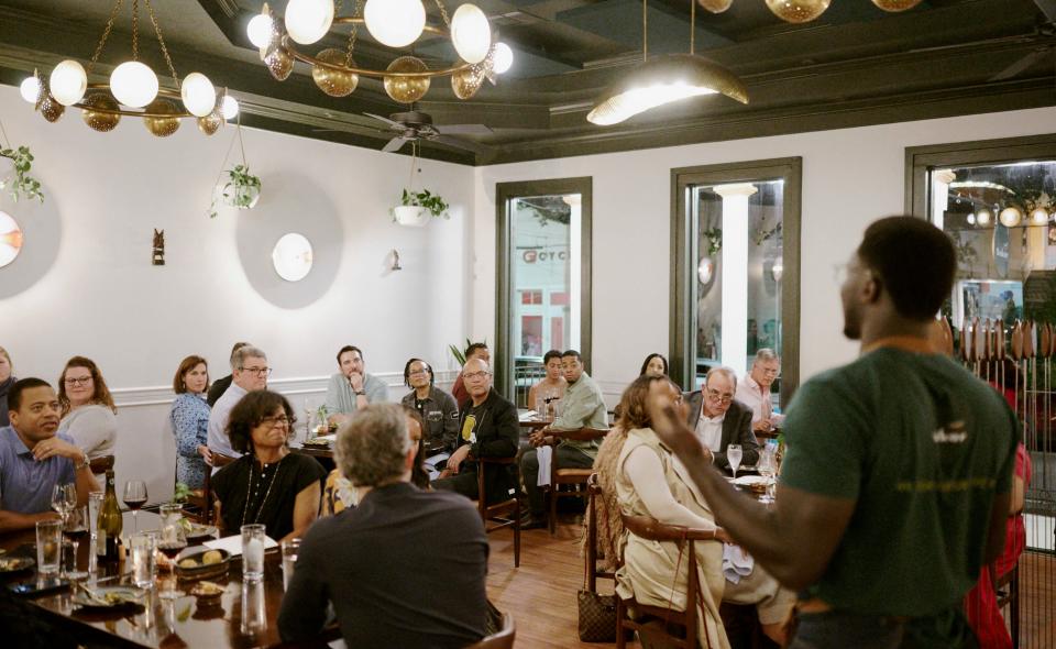 Chef Serigne Mbaye of Dakar NOLA in New Orleans presents a dish to diners.