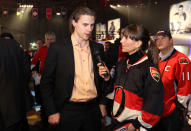 OTTAWA, ON - JANUARY 27: Erik Karlsson (L) of the Ottawa Senators speaks to fans during the NHL Fan Fair at the Ottawa Convention Centre on January 27, 2012 in Ottawa, Ontario, Canada. (Photo by Bruce Bennett/Getty Images)