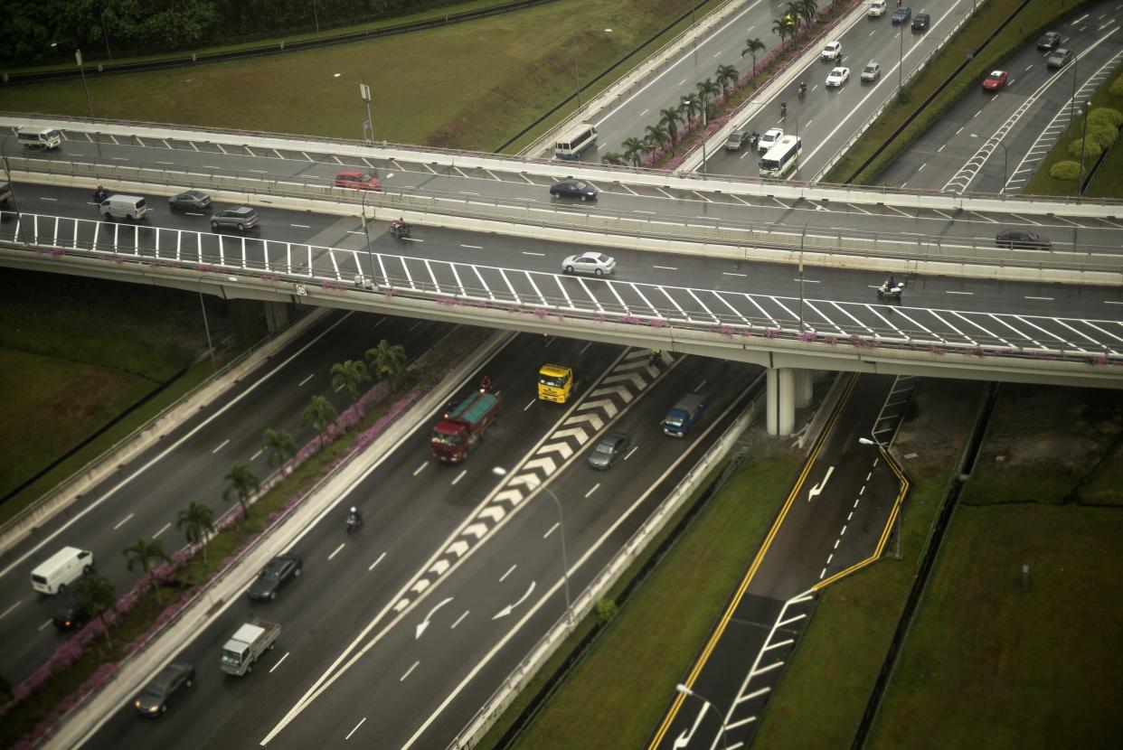 This aerial photo taken upon landing in Singapore shows cars and trucks on a motorway seen from the air on August 4, 2015. (BRENDAN SMIALOWSKI/AFP/Getty Images)