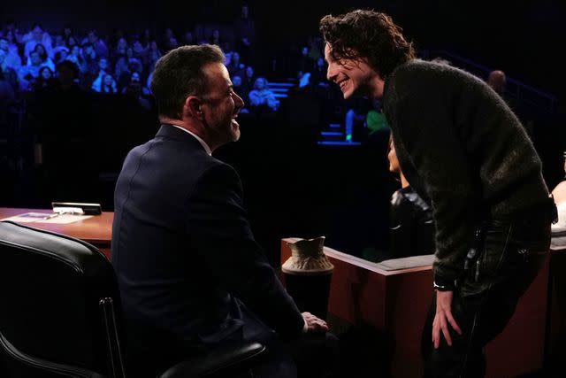 <p>Randy Holmes / Disney via Getty</p> Jimmy Kimmel chats with Timothee Chalamet on his show.