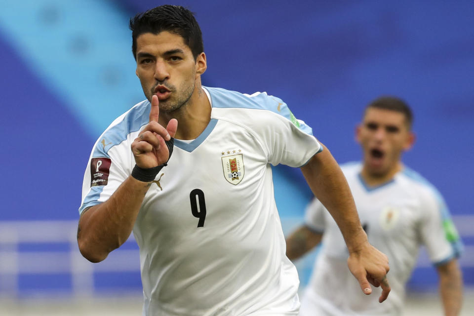 Uruguay's Luis Suarez celebrates after scoring from the penalty spot his side's second goal against Colombia during a qualifying soccer match for the FIFA World Cup Qatar 2022 at the Metropolitano stadium in Barranquilla, Colombia, Friday, Nov. 13, 2020. (AP Photo/Fernando Vergara)