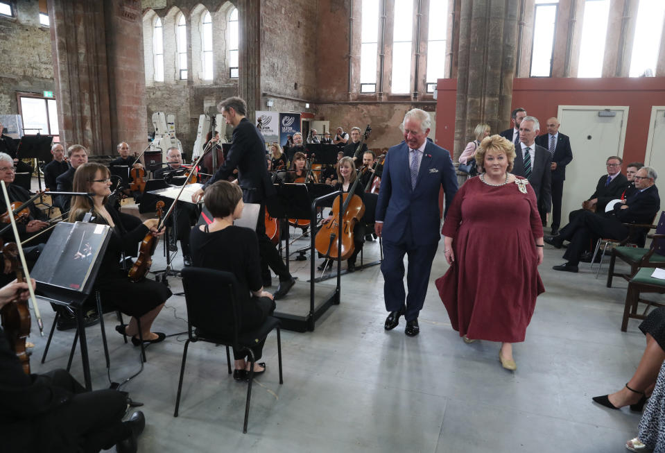 BELFAST, NORTHERN IRELAND - JUNE 12: Prince Charles, Prince of Wales and Fionnuala Jay-O'Boyle, founder of the Belfast Buildings Trust, meet members of the Ulster Orchestra during his visit to Carlisle Memorial Church on June 12, 2018 in Belfast, Northern Ireland. (Photo by Brian Lawless - WPA Pool/Getty Images)