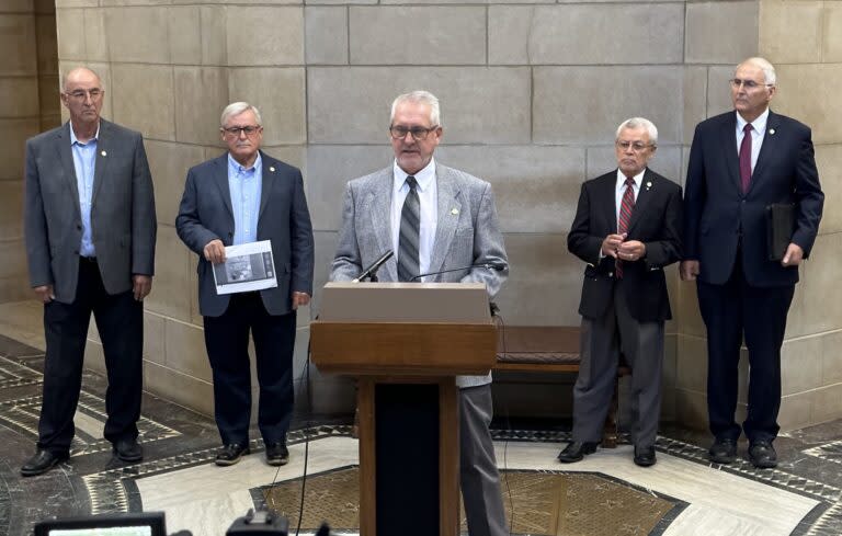 State Sen. Dave Murman, at the podium, calls for a legislative investigation of the Nebraska Department of Education on Oct. 17, 2022. (Aaron Sanderford/Nebraska Examiner)