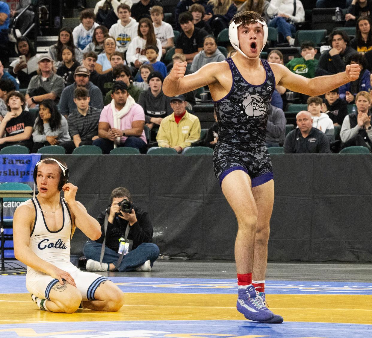 Rumson-Fair Haven's Sonny Amato celebrates after his 11-5 win over Christian Brothers Academy's Alex Nini in the NJSIAA 144-pound final.