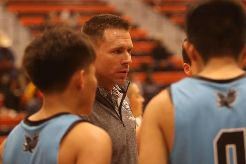 Navajo Prep boys basketball coach Matt Melvin instructs his team during a timeout in the third quarter of a basketball game against Grants in the first round of the Gallup High Invitational Tournament, Thursday, Jan. 5, 2023.