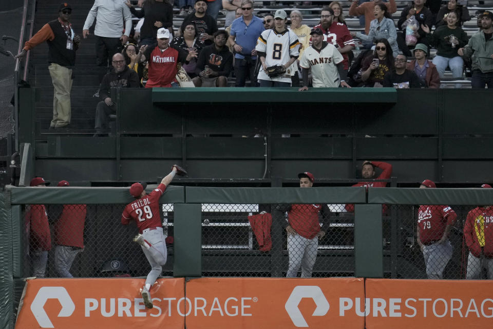 Cincinnati Reds center fielder TJ Friedl (29) is unable to catch a two-run home run by San Francisco Giants' Patrick Bailey during the third inning of a baseball game Tuesday, Aug. 29, 2023, in San Francisco. (AP Photo/Godofredo A. Vásquez)