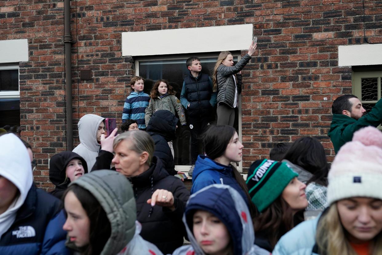 People line the streets as Biden tours Dundalk (AP)
