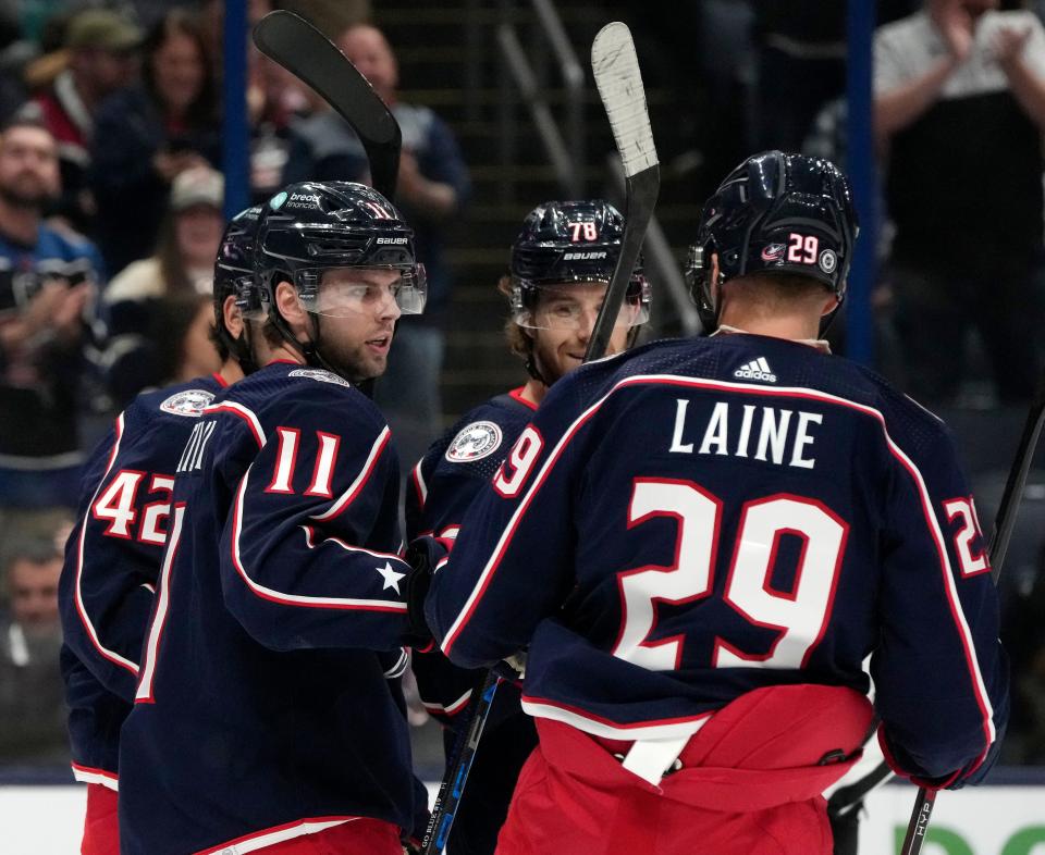 Sept. 24, 2023; Columbus, Oh., USA; 
Columbus Blue Jackets forward Adam Fantilli (11), Columbus Blue Jackets defender Damon Severson (78) and Columbus Blue Jackets forward Patrik Laine (29) celebrate a goal by Columbus Blue Jackets forward Alexandre Texier (42) during the first period of Sunday's hockey game against the Pittsburg Penguins at Nationwide Arena.