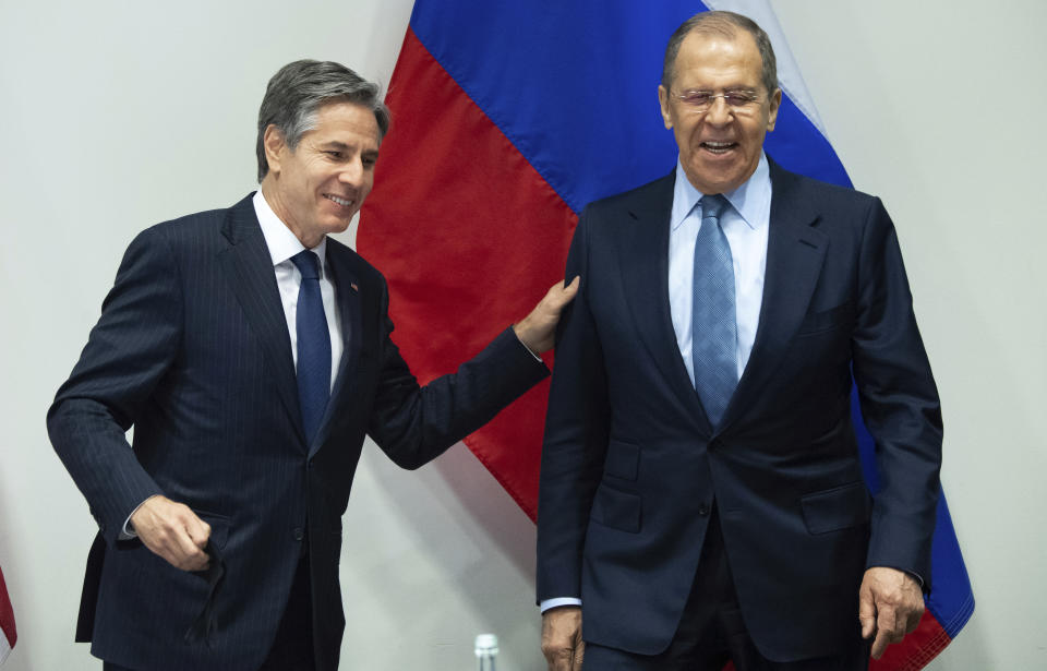 U.S. Secretary of State Antony Blinken, left, greets Russian Foreign Minister Sergey Lavrov, right, as they arrive for a meeting at the Harpa Concert Hall in Reykjavik, Iceland, Wednesday, May 19, 2021, on the sidelines of the Arctic Council Ministerial summit. (Saul Loeb/Pool Photo via AP)