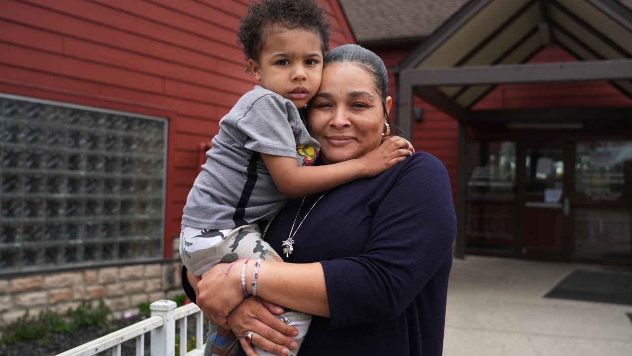 Tamika Blue hugs her 4-year-old son, Jaüvez Roberts, outside the YWCA Family Center, where they are now living. She has searched for months for a home for her and four of her children, but struggled to find one that was big  enough, affordable and would accept her federal Section 8 housing choice voucher.