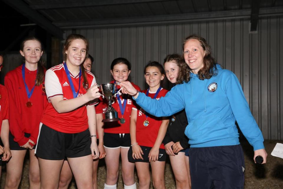 Captain of the Irvinestown Independent Methodist Leah Cuthbertson accepts the winners trophy on behalf of her team. <i>(Image: Tim Flaherty)</i>