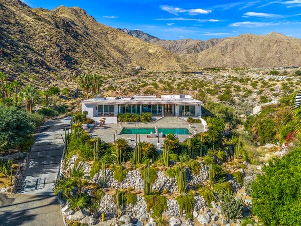 The 1960s home is surrounded by Palm Trees, cacti, and mountains, offering a private oasis to reconnect with nature all while being conveniently located to downtown Palm Springs.