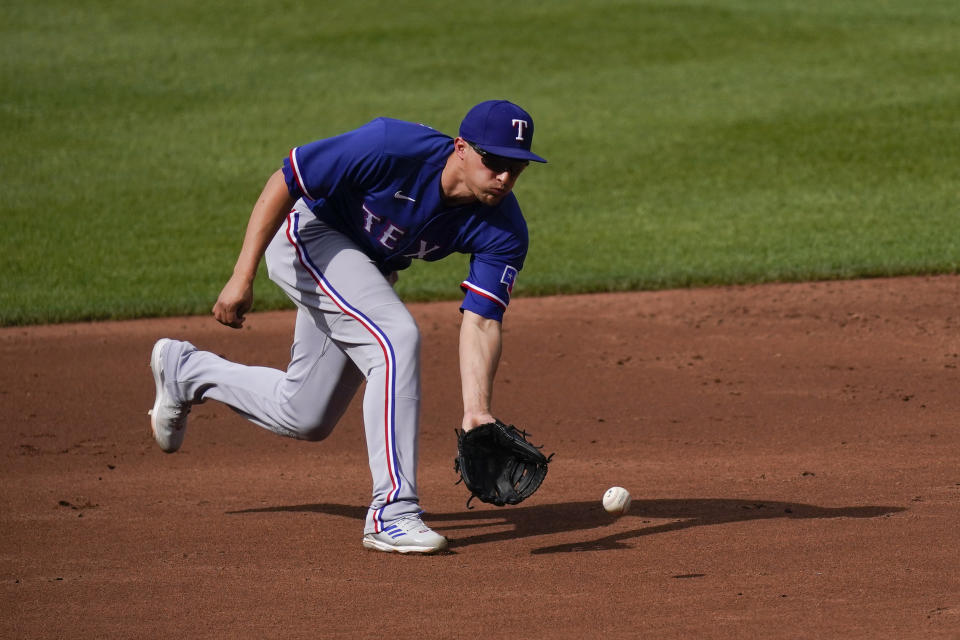 Texas Rangers shortstop Corey Seager fields a ground ball by the Baltimore Orioles during the second inning of a baseball game, Saturday, May 27, 2023, in Baltimore. (AP Photo/Julio Cortez)
