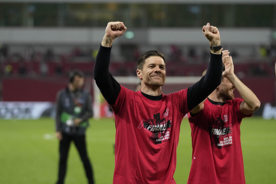 Leverkusen's head coach Xabi Alonso celebrates at the end of the Europa League second leg semi-final soccer match between Leverkusen and Roma at the BayArena in Leverkusen, Germany, Thursday, May 9, 2024. (AP Photo/Matthias Schrader)