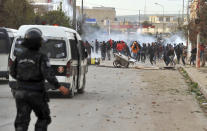 <p>Protesters confront riot police during anti-government protests, in Tebourba, south of the Tunisian capital, Tunis, Jan. 9, 2018. (Photo: Anis Ben Ali/AP) </p>