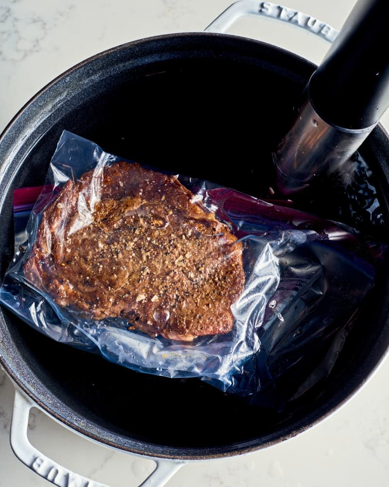 a steak in a pot with a sous vide machine