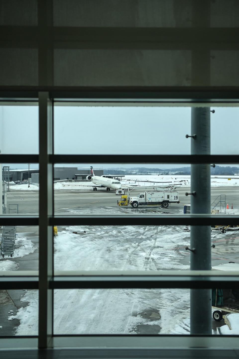 A plane is de-iced at McGhee Tyson Airport in Knoxville, Friday, Jan. 19, 2024.