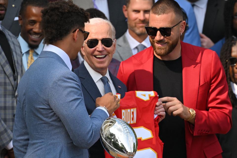 Kansas City Chiefs tight end Travis Kelce and quarterback Patrick Mahomes present US President Joe Biden with a jersey during a celebration for the Kansas City Chiefs, 2023 Super Bowl champions, on the South Lawn of the White House in Washington, DC, on June 5, 2023. (Photo by Mandel NGAN / AFP) (Photo by MANDEL NGAN/AFP via Getty Images)