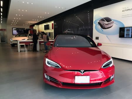 FILE PHOTO: A Tesla Model S car is seen in a showroom in Santa Monica, California, U.S., January 4, 2018. REUTERS/Lucy Nicholson