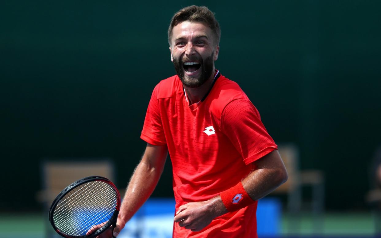 Liam Broady of British Bulldogs celebrates in his singles match against Ryan Peniston of Union Jacks during day seven of the St. James's Place Battle Of The Brits Team Tennis at National Tennis Centre -  - GETTY IMAGES