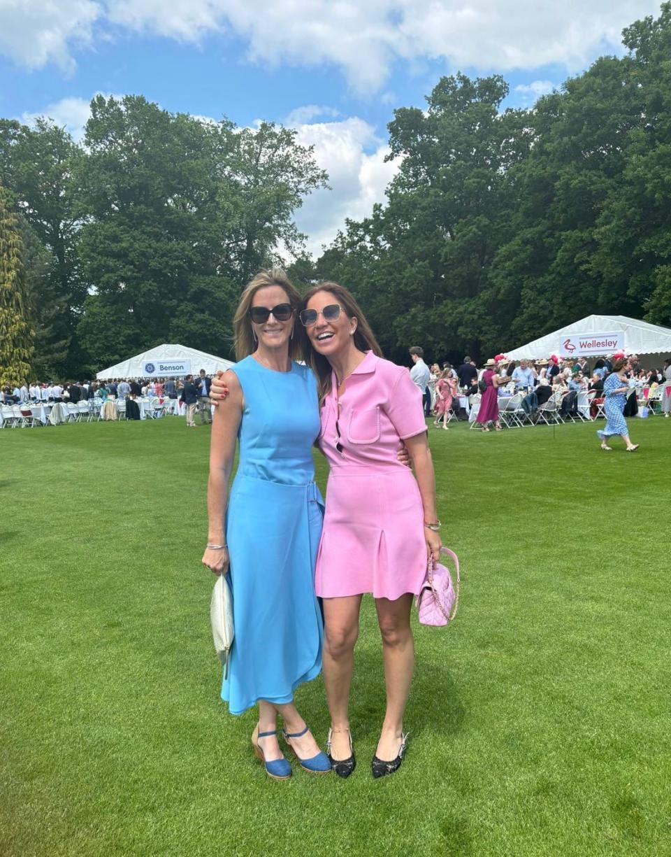 two women in dresses