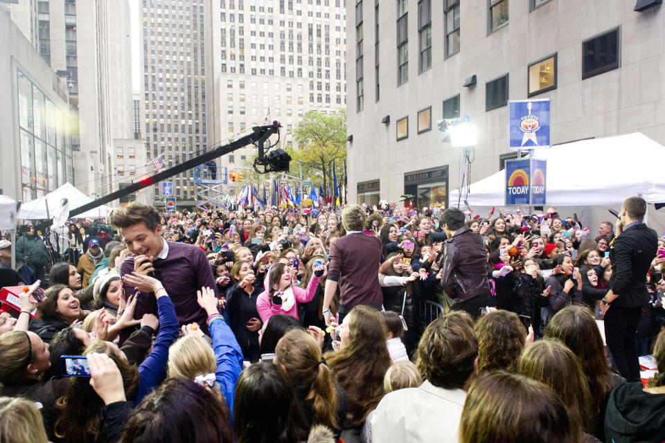 One Direction member Louis Tomlinson, left, performs on NBC's "Today" show on Tuesday, Nov. 13, 2012 in New York. (Photo by Charles Sykes/Invision/AP)