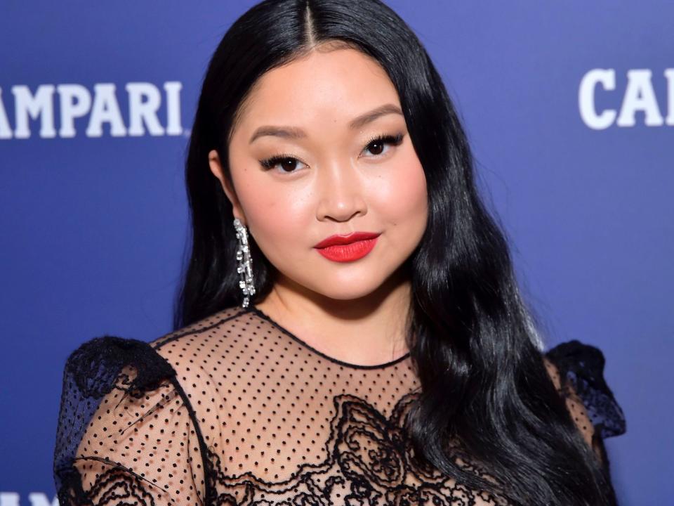 Lana Condor posing at the red carpet of the 23rd Costume Designer Guild Awards on April 13, 2021 in Los Angeles, California.