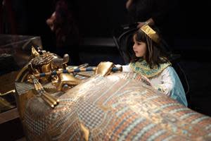A child dressed up as Cleopatra was excited to see the exhibit on Opening Day, Saturday, March 18 at COSI.