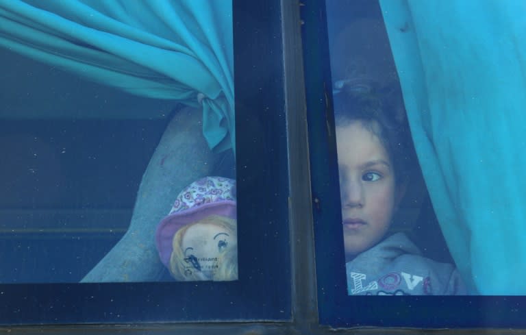 A girl evacuated from Waer, the last opposition-held district of Homs, arrives in the northern Syrian town of al-Bab on March 19, 2017