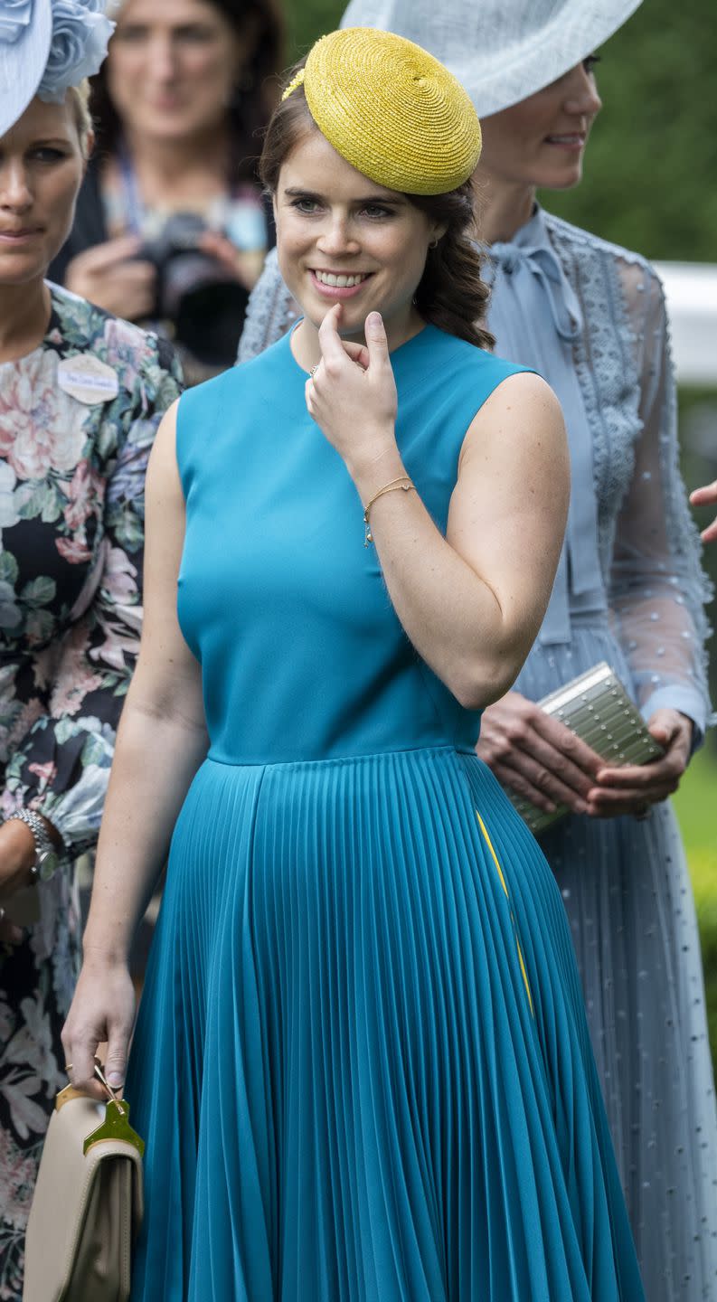 <p>Princess Eugenie looked stunning in the color of the day (blue!) at Royal Ascot. The strict event dress code dictates ladies wear dresses or skirts that fall at the knee or longer. No strapless or halterneck silhouettes are allowed. </p><p><strong>RELATED: <a href="https://www.goodhousekeeping.com/life/a21614445/royal-ascot-strict-rules/" rel="nofollow noopener" target="_blank" data-ylk="slk:The Insanely Strict Rules Royals Must Follow During the Royal Ascot;elm:context_link;itc:0;sec:content-canvas" class="link ">The Insanely Strict Rules Royals Must Follow During the Royal Ascot</a></strong></p>