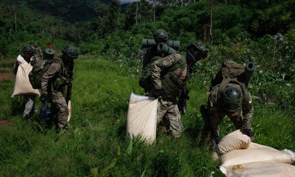 Members of the Peruvian Armed Forces destroy a clandestine airstrip in the VRAEM.