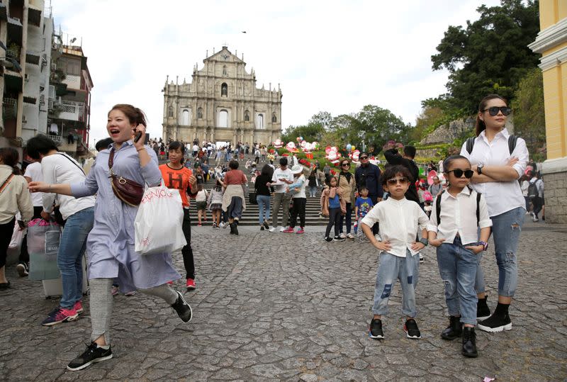 Tourists visit the Ruins of St. Paul's in Macau