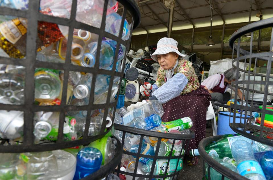 <span class="caption">A 77-year-old volunteer working at a recycling center run by a nonprofit Buddhist organization in Taipei, Taiwan.</span> <span class="attribution"><a class="link " href="https://www.gettyimages.com/detail/news-photo/this-photo-taken-on-july-16-2018-shows-yan-chun-a-77-year-news-photo/1002390668?adppopup=true" rel="nofollow noopener" target="_blank" data-ylk="slk:CHRIS STOWERS/AFP via Getty Images;elm:context_link;itc:0;sec:content-canvas">CHRIS STOWERS/AFP via Getty Images</a></span>