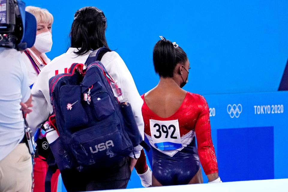 Simone Biles (USA) walks off the floor after the first rotation during the Tokyo 2020 Olympic Summer Games at Ariake Gymnastics Centre on July 27, 2021.