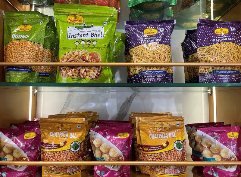 A view shows packets of snacks on shelves inside a Haldiram's restaurant in Mumbai