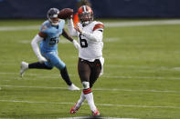 Cleveland Browns quarterback Baker Mayfield (6) throws as he scrambles against the Tennessee Titans in the first half of an NFL football game Sunday, Dec. 6, 2020, in Nashville, Tenn. (AP Photo/Wade Payne)