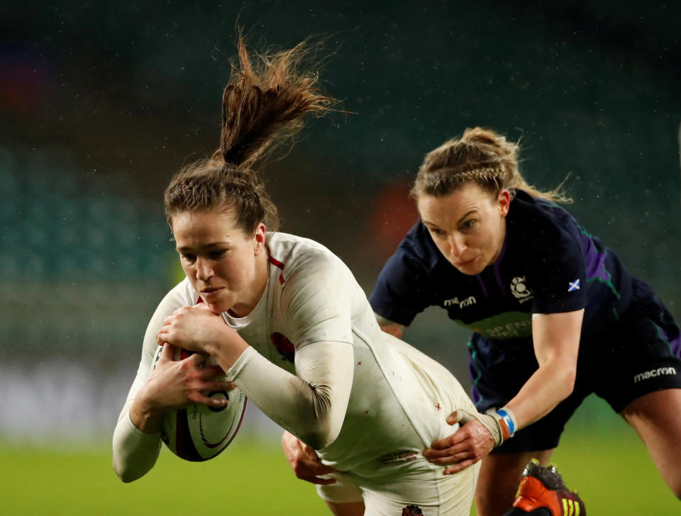 Rugby Union - Women's Six Nations Championship - England v Scotland - Twickenham Stadium, London, Britain - March 16, 2019   England's Emily Scarratt in action with Scotland's Chloe Rollie as she scores a try   Action Images/Andrew Boyers