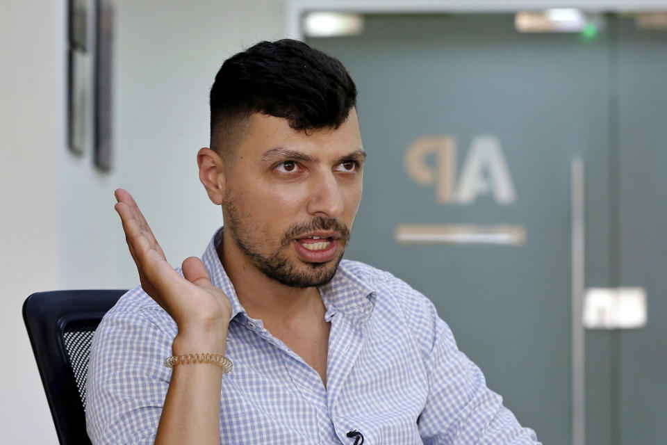 In this Thursday, June 20, 2019 photo, Mohammed Awwad, 27, a Lebanese Muslim who was prevented from renting an apartment in the Christian village of Hadat, speaks during an interview with The Associated Press in Beirut, Lebanon. The town's Muslim ban, imposed years ago, has recently sparked a national outcry. The case reflects Lebanon's rapidly changing demographic make-up against the backdrop of deep-rooted sectarian divisions that once erupted into a 15-year civil war. (AP Photo/Bilal Hussein)