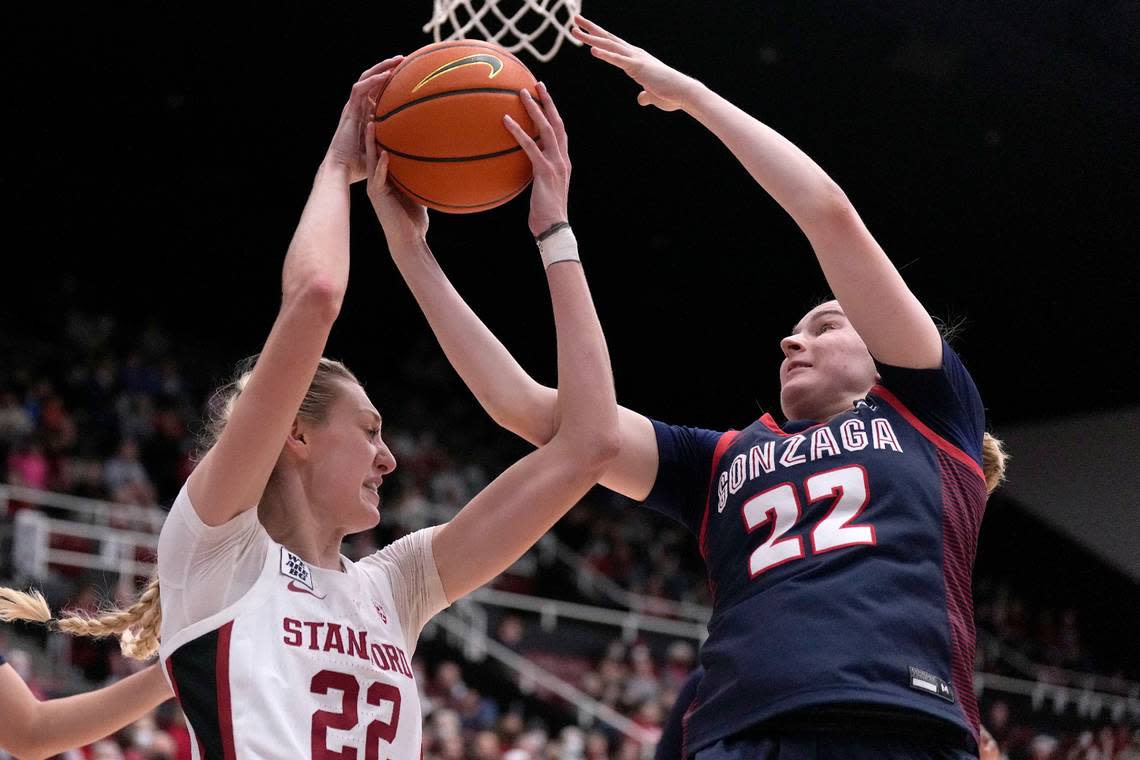 Stanford forward Cameron Brink, left, battles for a rebound against Gonzaga guard Brynna Maxwell, right, during the second half of an NCAA college basketball game in Stanford, Calif., Sunday, Dec. 4, 2022. (AP Photo/Tony Avelar)