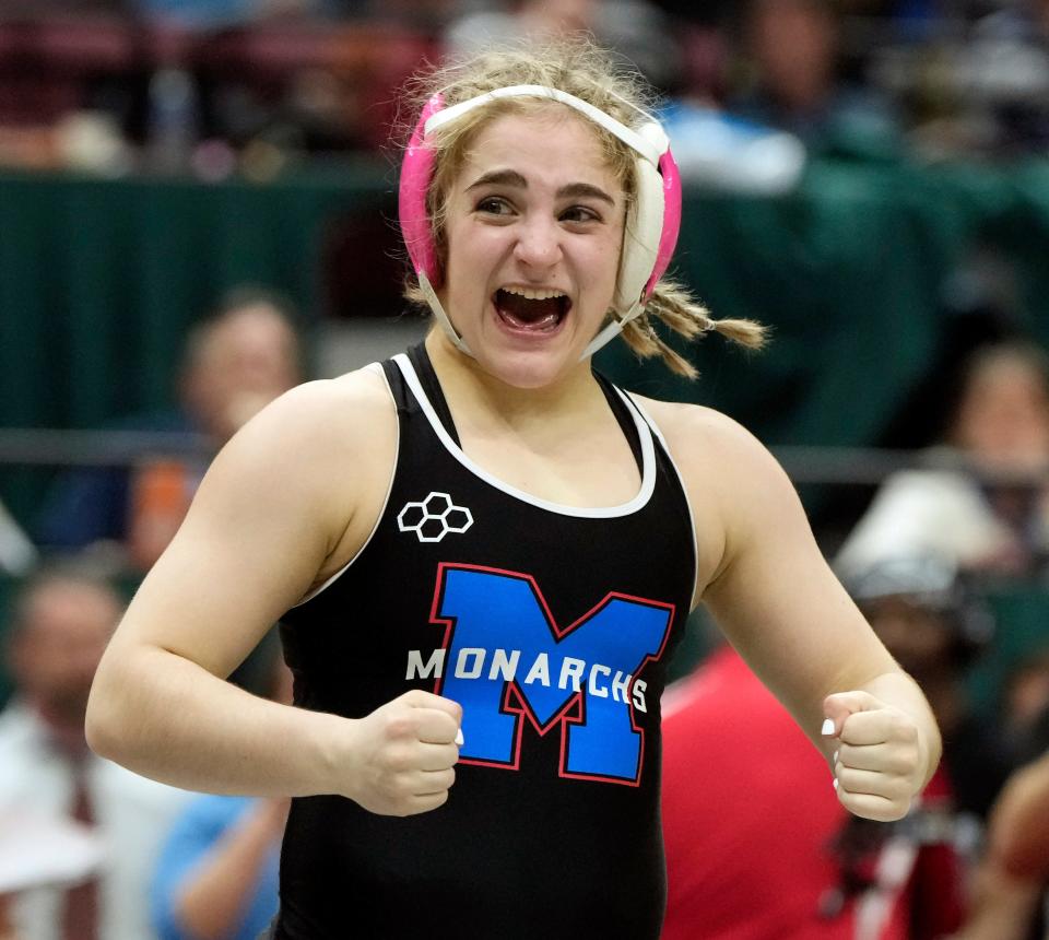 Marysville's Cali Leng celebrates winning the 120-pound title in the first OHSAA girls wrestling state tournament.