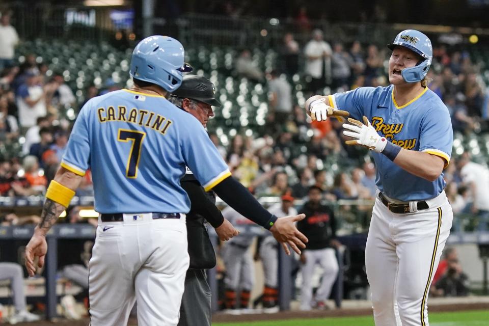 Milwaukee Brewers' Joey Wiemer is congratulated by Victor Caratini after hitting a two-run home run during the third inning of a baseball game against the Baltimore Orioles Wednesday, June 7, 2023, in Milwaukee. (AP Photo/Morry Gash)