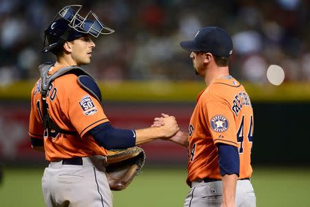 Oct 3, 2015; Phoenix, AZ, USA; Houston Astros catcher Jason Castro (15) and Houston Astros relief pitcher Luke Gregerson (44) react after defeating the Arizona Diamondbacks at Chase Field. The Astros won 6-2. Joe Camporeale-USA TODAY Sports