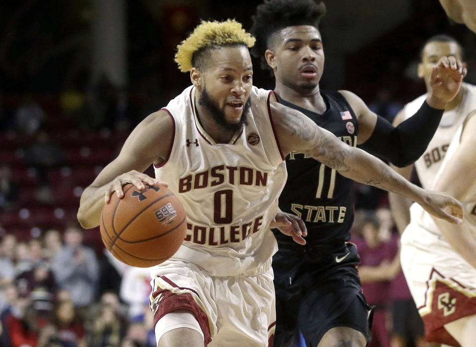 Boston College's Ky Bowman (0) drives toward the basket past Florida State's David Nichols (11) in the second half of an NCAA college basketball game, Sunday, Jan. 20, 2019, in Boston. (AP Photo/Steven Senne)