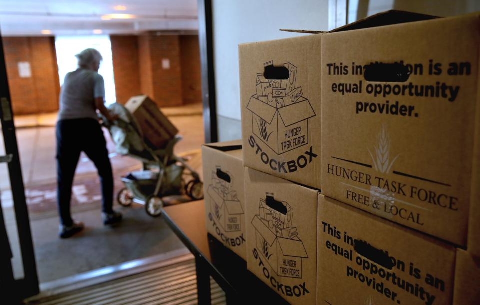 A Hunger Task Force stock box recipient leaves with one of the monthly food boxes distributed by Ascension SE Wisconsin Hospital - St. Joseph Campus. On the first Wednesday of every month in partnership with the Hunger Task Force, St. Joseph gives out 30 to 40 meal boxes to the elderly.